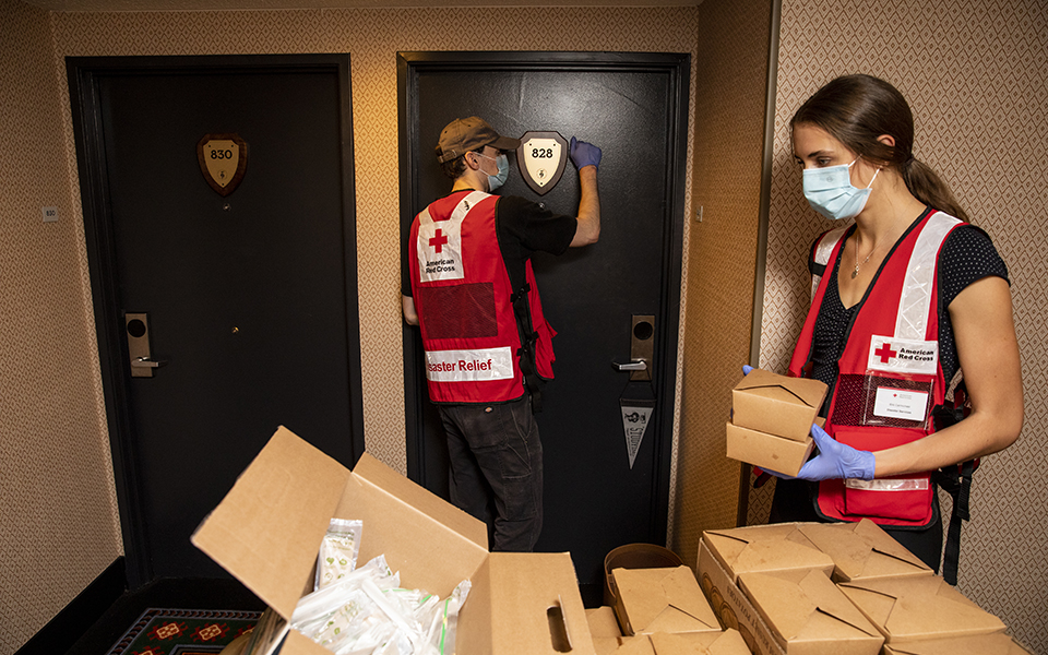 September 14, 2020. Eugene, Oergon.
American Red Cross volunteers Grace Proudfoot, right, and Kalen Pippins, deliver meals to evacuees from the Oregon wildfires at a hotel that is being used by the American Red Cross as a shelter in, Eugene, OR, on Monday, September 14, 2020.
Photo by Scott Dalton/American Red Cross